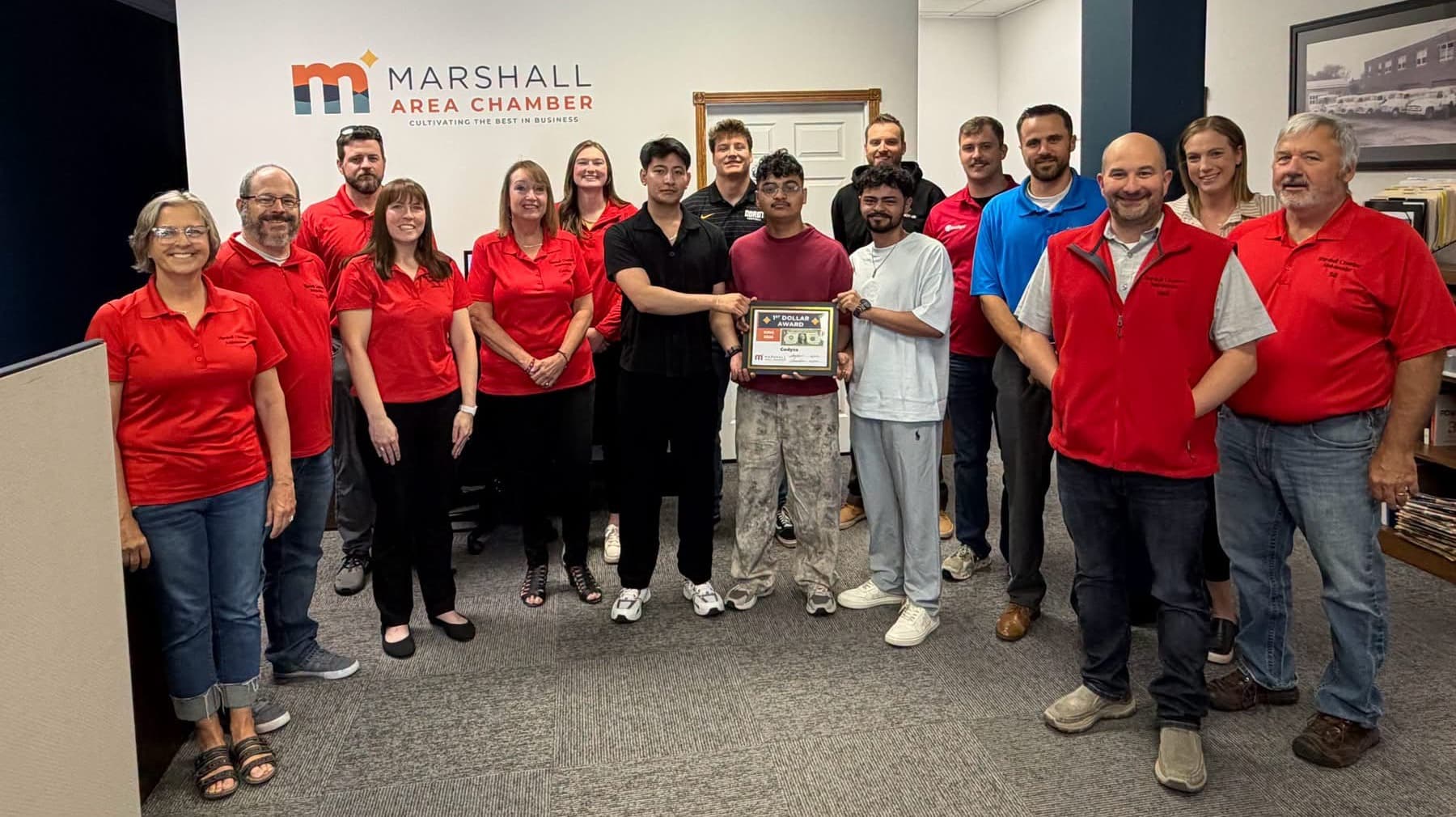 The Codyza team holding the 1st Dollar Award with members of the Marshall Area Chamber of Commerce